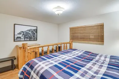 a bedroom with a bed and a window at Condo with Pool Access 2 Mi to Winter Park Resort! in Winter Park