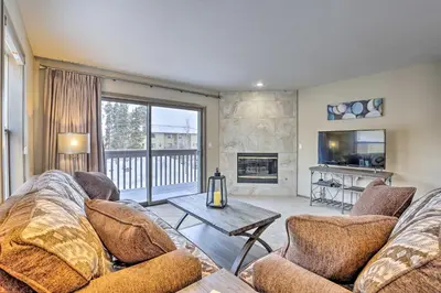a living room with a couch and a fireplace at 8 Mi to Copper Mtn Sleek Frisco Townhome with Views in Frisco