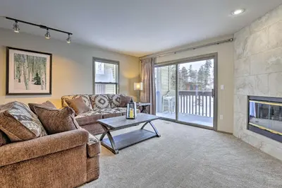 a living room with a couch and a fireplace at 8 Mi to Copper Mtn Sleek Frisco Townhome with Views in Frisco