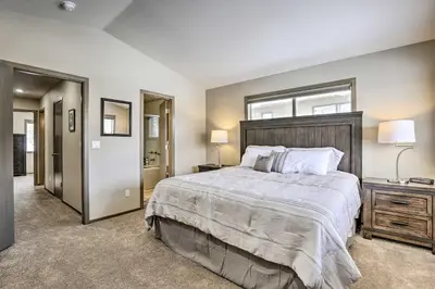 a bedroom with a large bed and a window at 8 Mi to Copper Mtn Sleek Frisco Townhome with Views in Frisco