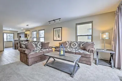 a living room with two couches and a table at 8 Mi to Copper Mtn Sleek Frisco Townhome with Views in Frisco