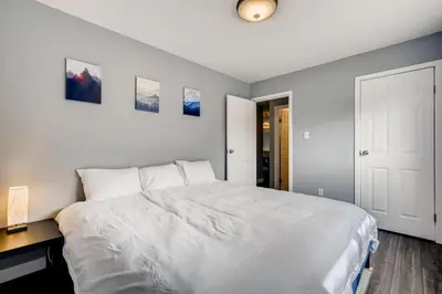 a bedroom with a large white bed and a desk at Mount Royal Condos #501 condo in Frisco