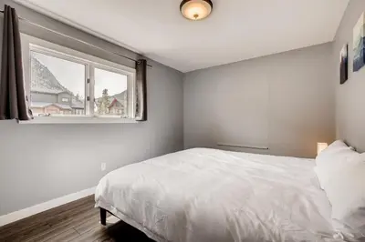 a bedroom with a white bed and a window at Mount Royal Condos #501 condo in Frisco