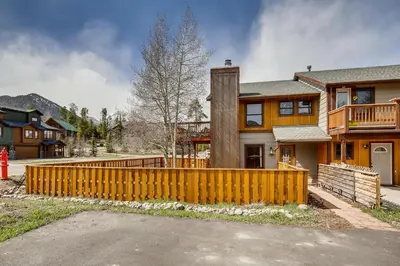 a wooden fence in front of a house at Mount Royal Condos #501 condo in Frisco