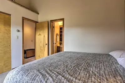 a bedroom with a large bed in a room at Resort Perks and Trail Access Silverthorne Condo! in Silverthorne