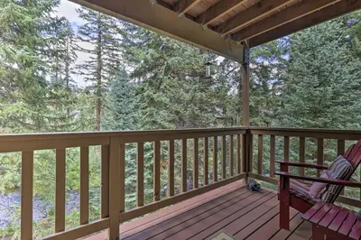 a screened porch with a bench and a swing at Cozy Condo on Vasquez Creek with Free Shuttle Access in Winter Park