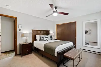a bedroom with a bed and a ceiling fan at Horsetooth Stoop Trails, Lake Access and Mountain Views in Fort Collins