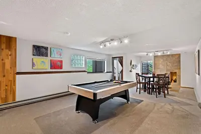 a room with a pool table and a dining room at Horsetooth Stoop Trails, Lake Access and Mountain Views in Fort Collins