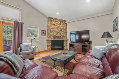 a living room with a couch and a fireplace at Cutty Sark Court #1 3BR Mountain Views townhouse in Silverthorne