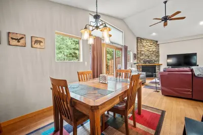 a dining room with a table and chairs at Cutty Sark Court #1 3BR Mountain Views townhouse in Silverthorne