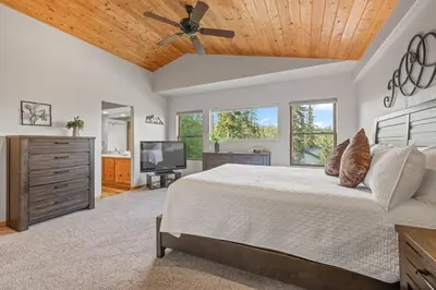a bedroom with a bed and a ceiling fan at Cutty Sark Court #2 3BR Mountain Views townhouse in Silverthorne