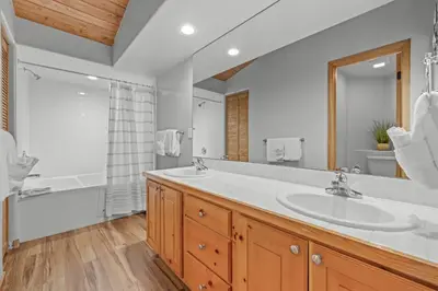 a bathroom with a sink and a tub and a shower at Cutty Sark Court #2 3BR Mountain Views townhouse in Silverthorne