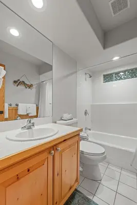 a bathroom with a sink and a toilet and a tub at Cutty Sark Court #2 3BR Mountain Views townhouse in Silverthorne