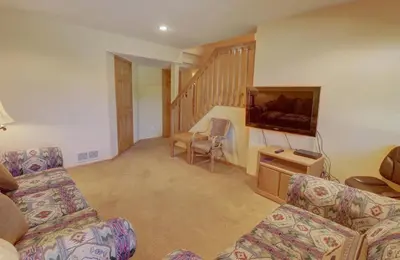 a living room with two couches and a flat screen tv at 75 Corinthian 3Br 3Ba Spacious Layout, Private Garage townhouse in Dillon