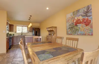 a kitchen and dining room with a wooden table at 75 Corinthian 3Br 3Ba Spacious Layout, Private Garage townhouse in Dillon