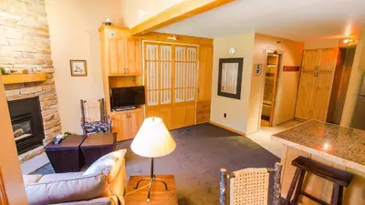a living room with a couch and a fireplace at Iron Horse C5083 condo in Winter Park
