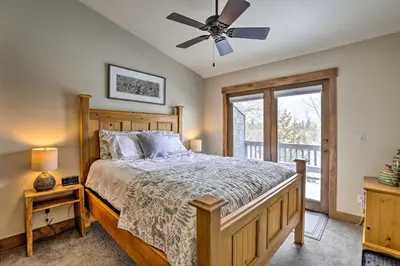 a bedroom with a bed and a ceiling fan at Frisco Home with Mountain Views Walk to Main St! in Frisco
