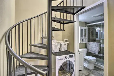 a laundry room with a washer and dryer at Walk to Ski Lifts Mtn-View Granby Retreat! in Granby