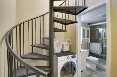 a laundry room with a washer and dryer at Walk to Ski Lifts Mtn-View Granby Retreat! in Granby