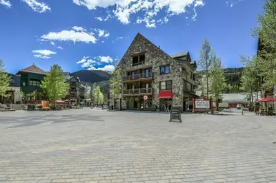 a town square in the mountains with a building at 2 Bedroom Blackbear Lodge Condo In River Run Village in Keystone