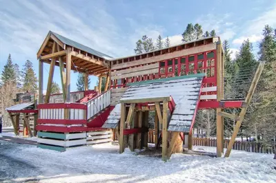 a building with a staircase in the snow at 8166 Silver Mill in Keystone