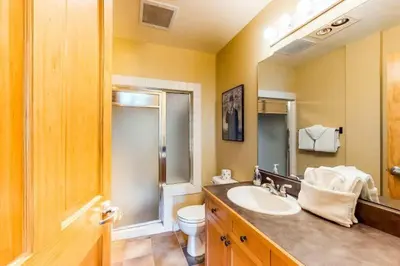 a bathroom with a sink and a toilet and a mirror at 8166 Silver Mill in Keystone