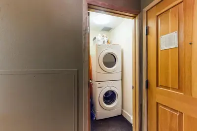 a washer and dryer in a room with a door at 8166 Silver Mill in Keystone