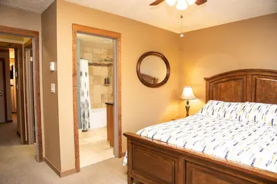 a bedroom with a bed and a mirror at 1221 Keystone Gulch condo in Keystone