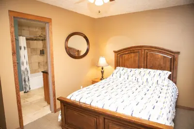 a bedroom with a bed and a mirror on the wall at 1221 Keystone Gulch condo in Keystone