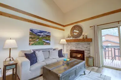a living room with a couch and a fireplace at 201C Mountain Side 1BR 1BA condo in Frisco