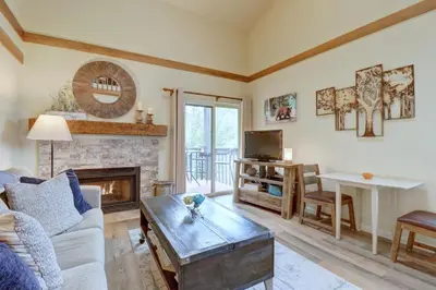a living room with a couch and a fireplace at 201C Mountain Side 1BR 1BA condo in Frisco