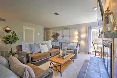 a living room with a couch and a table at Ski, Shred and Tube Mtn-View Condo in Silverthrone! in Silverthorne