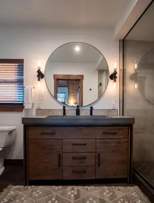 a bathroom with a sink and a mirror at Relax in Luxury - Jacuzzi, Indoor/Outdoor Fireplace in Estes Park