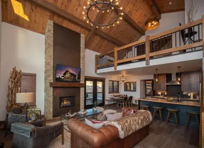 a living room with a couch and a fireplace at Relax in Luxury - Jacuzzi, Indoor/Outdoor Fireplace in Estes Park