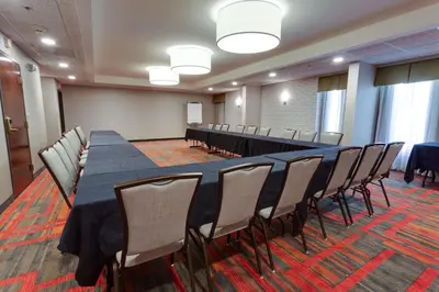 a conference room with a long table and chairs at Drury Inn & Suites Denver Tech Center in Centennial