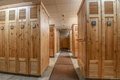 a row of wooden lockers in a locker room at 8176 Silver Mill condo in Keystone