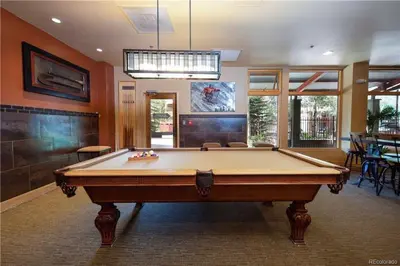 a large room with a pool table in it at 8176 Silver Mill condo in Keystone