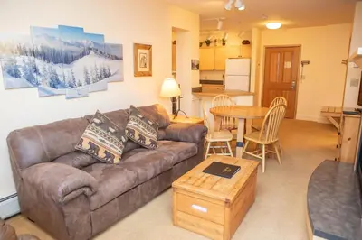 a living room with a couch and a table at 8176 Silver Mill condo in Keystone