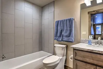 a bathroom with a toilet and a tub and a sink at Relax Fireside Silverthorne Home 11 Mi to Skiing! in Silverthorne