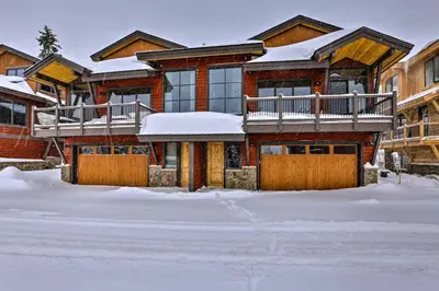a house with snow on the ground in front of it at Relax Fireside Silverthorne Home 11 Mi to Skiing! in Silverthorne