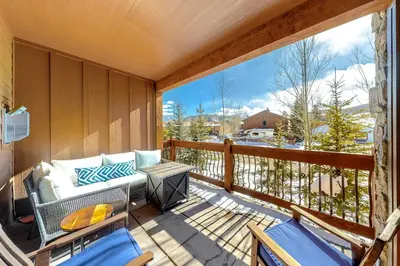 a porch with a couch and chairs on a balcony at Frisco Frolic in Frisco