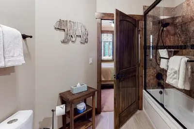 a bathroom with a shower and a toilet at Frisco Frolic in Frisco