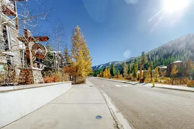 an empty street with the sun in the sky at Founders Pointe Condo in Winter Park