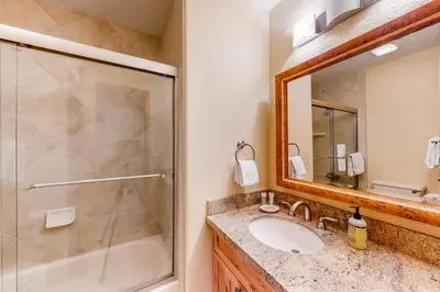 a bathroom with a sink and a shower at Dawn's Cabin in Frisco