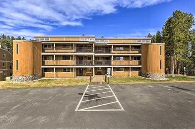 a large building with a parking lot in front of it at Cozy Ski Chalet Less Than 3 Mi to Winter Park Resort! in Winter Park