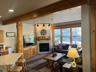 a living room with a couch and a fireplace at 8750 Trappers Crossing condo in Keystone