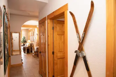 a pair of skis are hanging on a wall at 8750 Trappers Crossing condo in Keystone