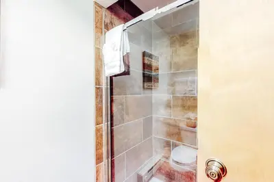 a shower with a glass door in a bathroom at Marina Place 336 in Dillon