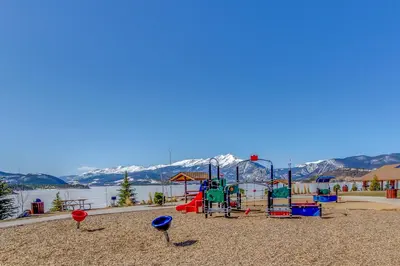 a playground in front of a body of water at Marina Place 336 in Dillon