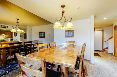 a dining room with a wooden table and chairs at Marina Place 336 in Dillon